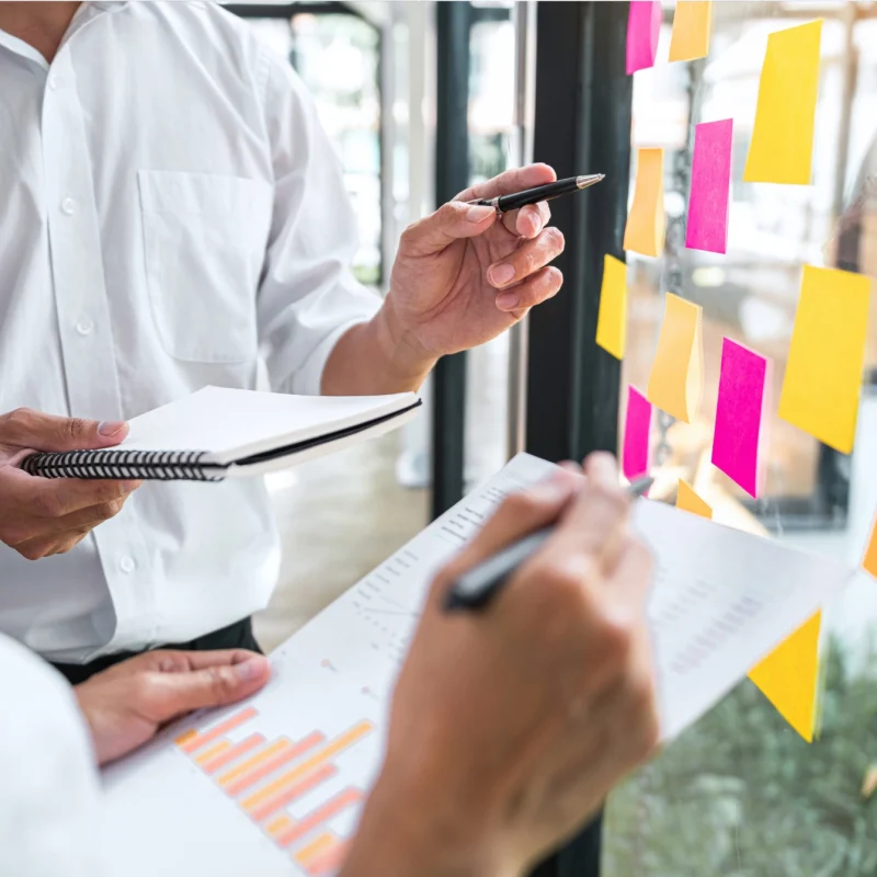 team defines market strategy on different notes in office